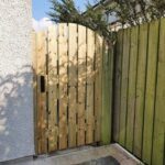 Planed all round timber arched gate